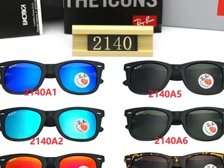 Eight pairs of sunglasses arranged on a board beside a model plaque